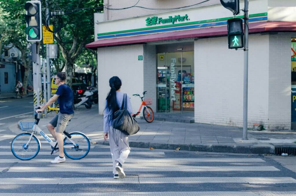 woman crossing on pedestrian lane